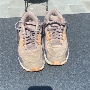 Grey and metallic Nike airs